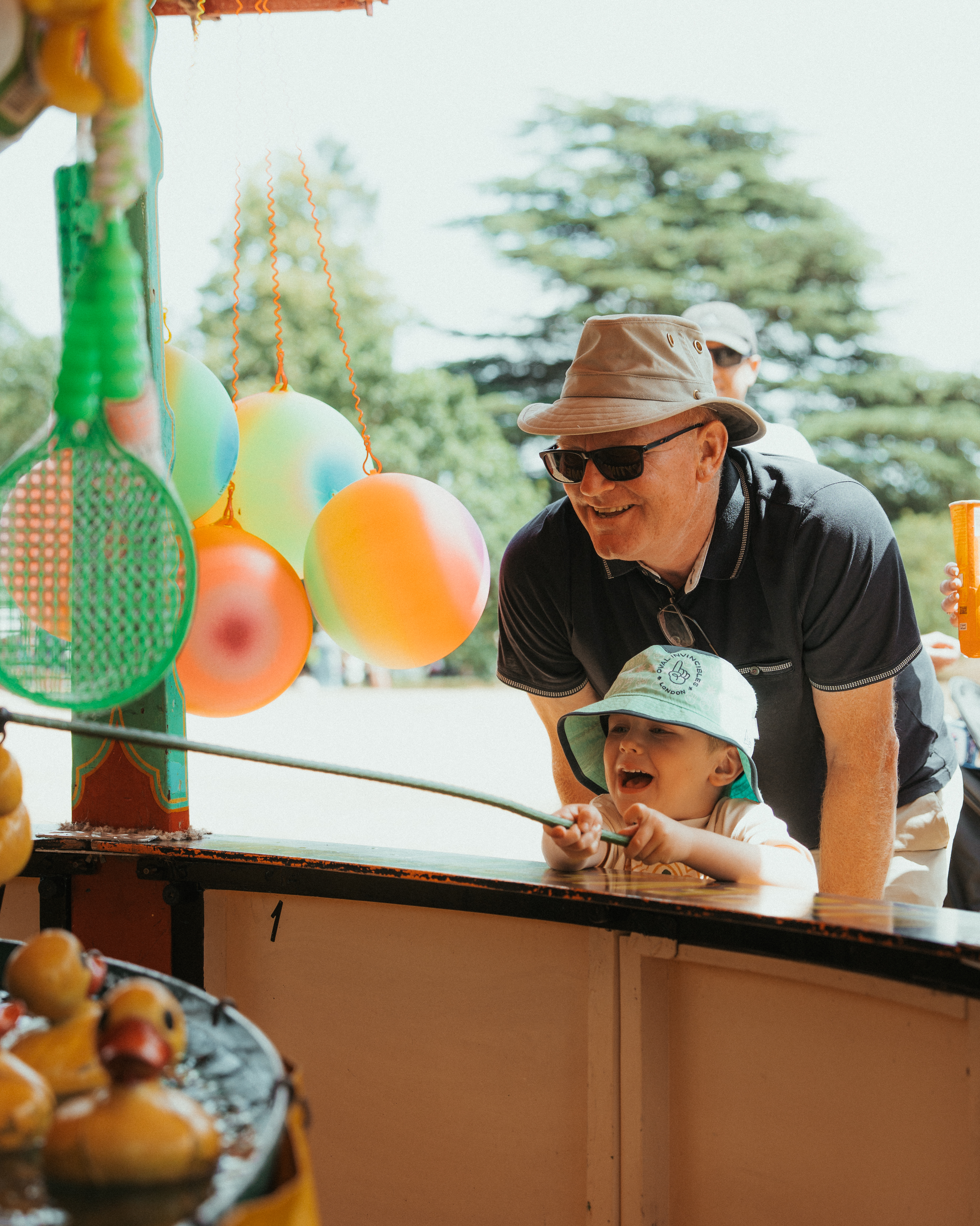 Grandfather And Grandson Playing Hook A Duck At Summer Fete Open Weekend 2026.© The Shuttleworth Trust. Photo Mach 3 Studio (Portrait)
