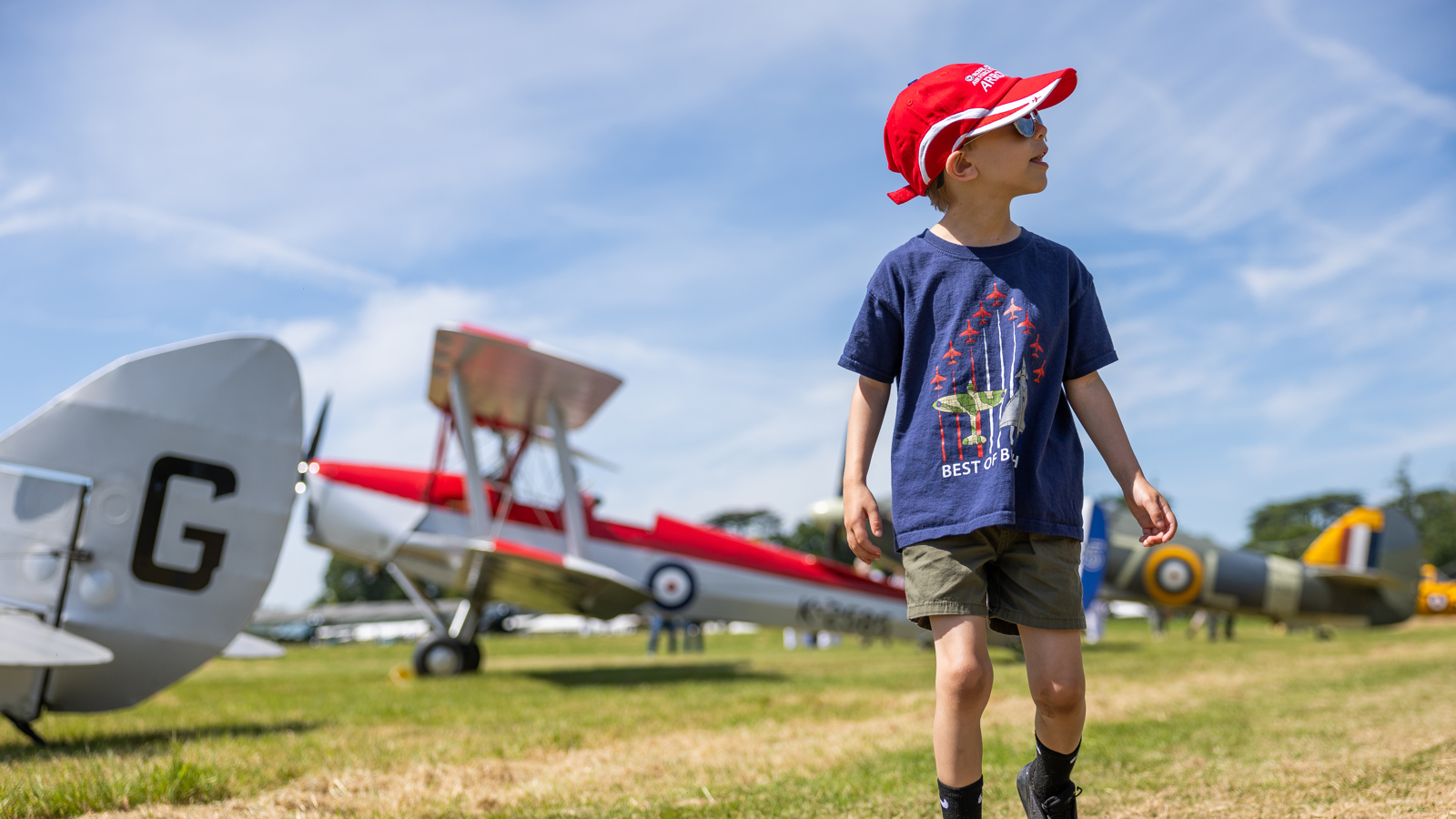 Boy Walking Among Aircraft 2. Festival Of Flight 2024 © The Shuttleworth Trust. Photo Phil Chaplin