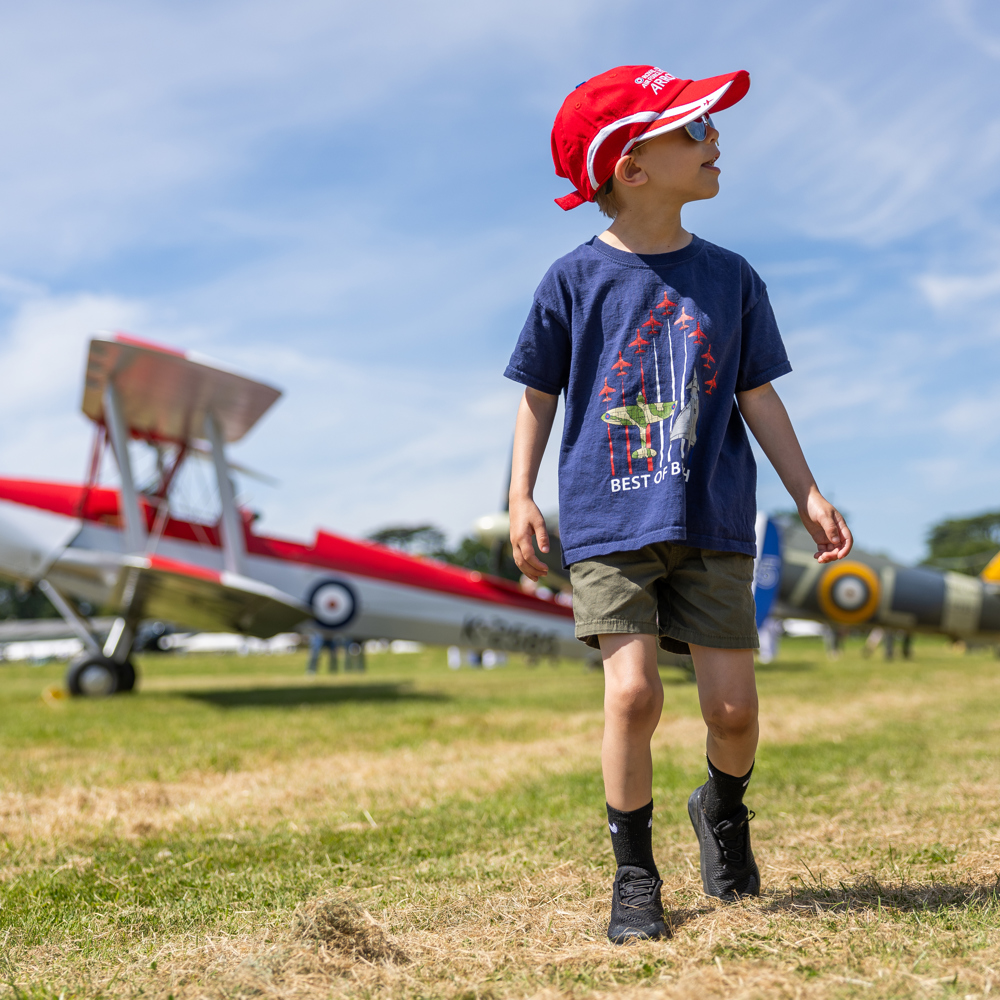 Boy Walking Among Aircraft 2. Festival Of Flight 2024 © The Shuttleworth Trust. Photo Phil Chaplin