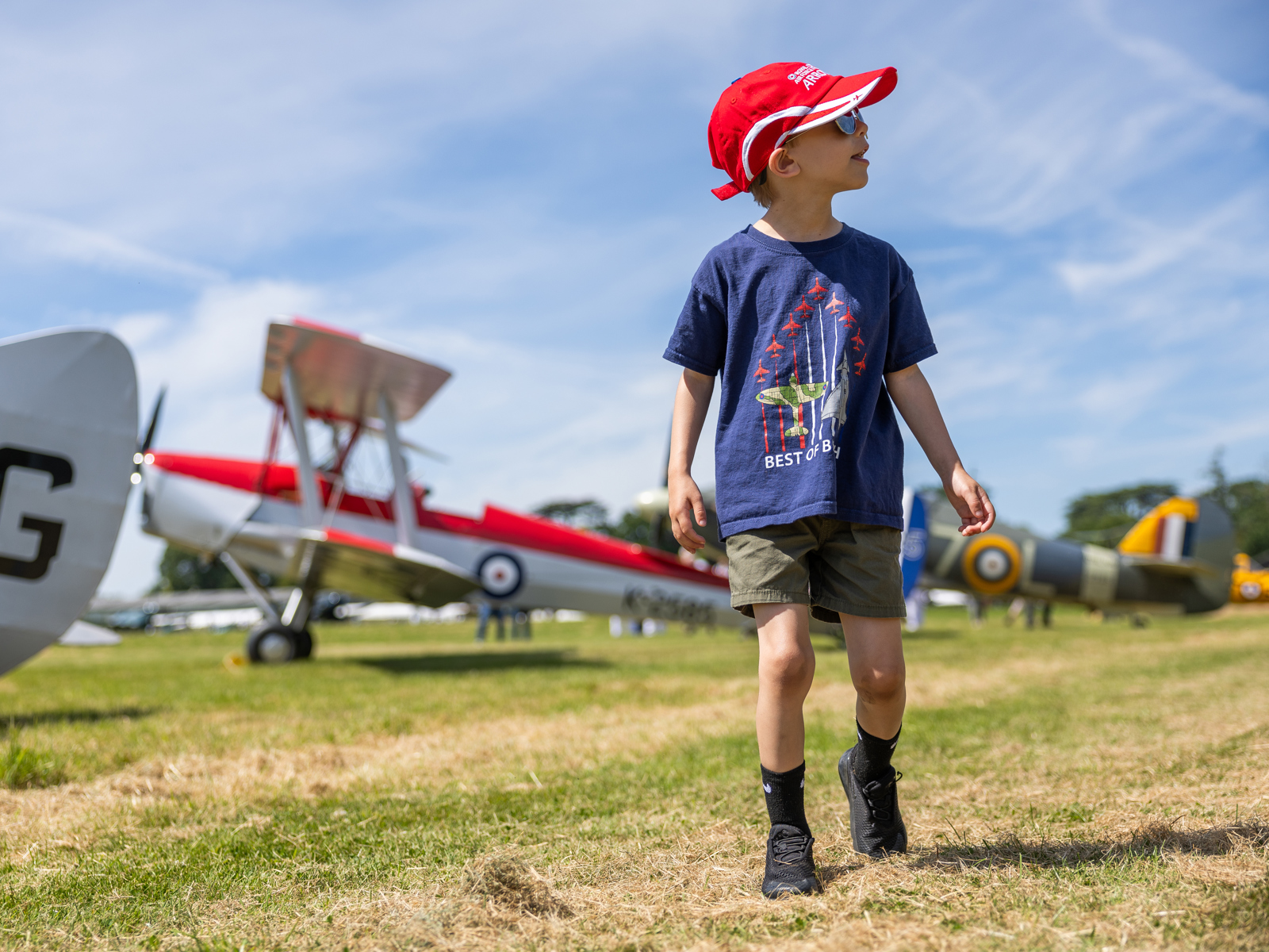 Boy Walking Among Aircraft 2. Festival Of Flight 2024 © The Shuttleworth Trust. Photo Phil Chaplin