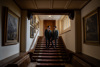 A Couple On A Staircase In Shuttleworth House. © The Shuttleworth Trust. Photo Lorna Newman