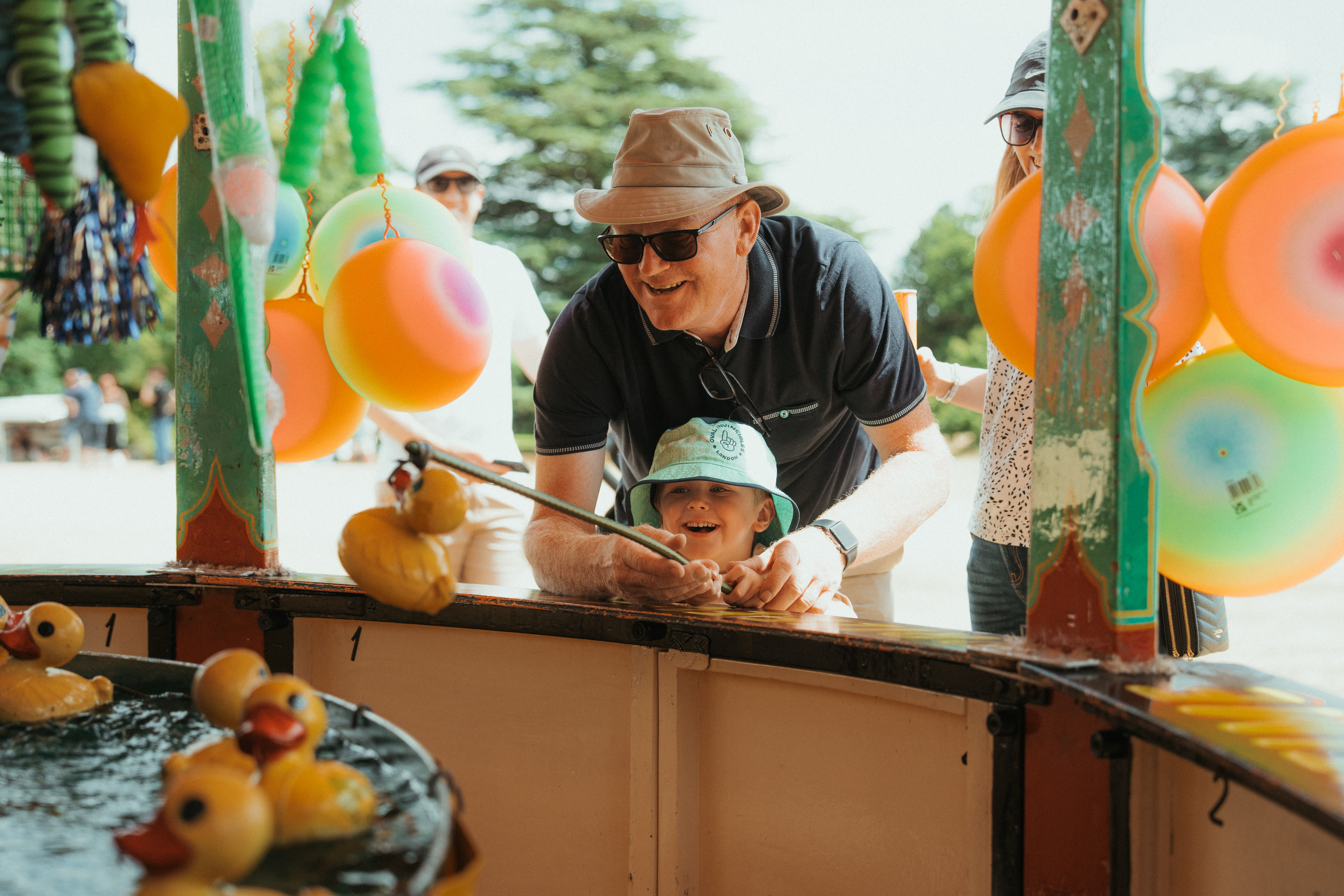 Grandfather And Grandson Playing Hook A Duck At Summer Fete Open Weekend 2026.© The Shuttleworth Trust. Photo Mach 3 Studio