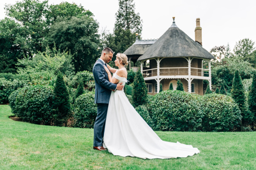 Couple By Swiss Cottage In Swiss Garden, Shuttleworth House. © The Shuttleworth Trust. Photo Tom Bond Photography