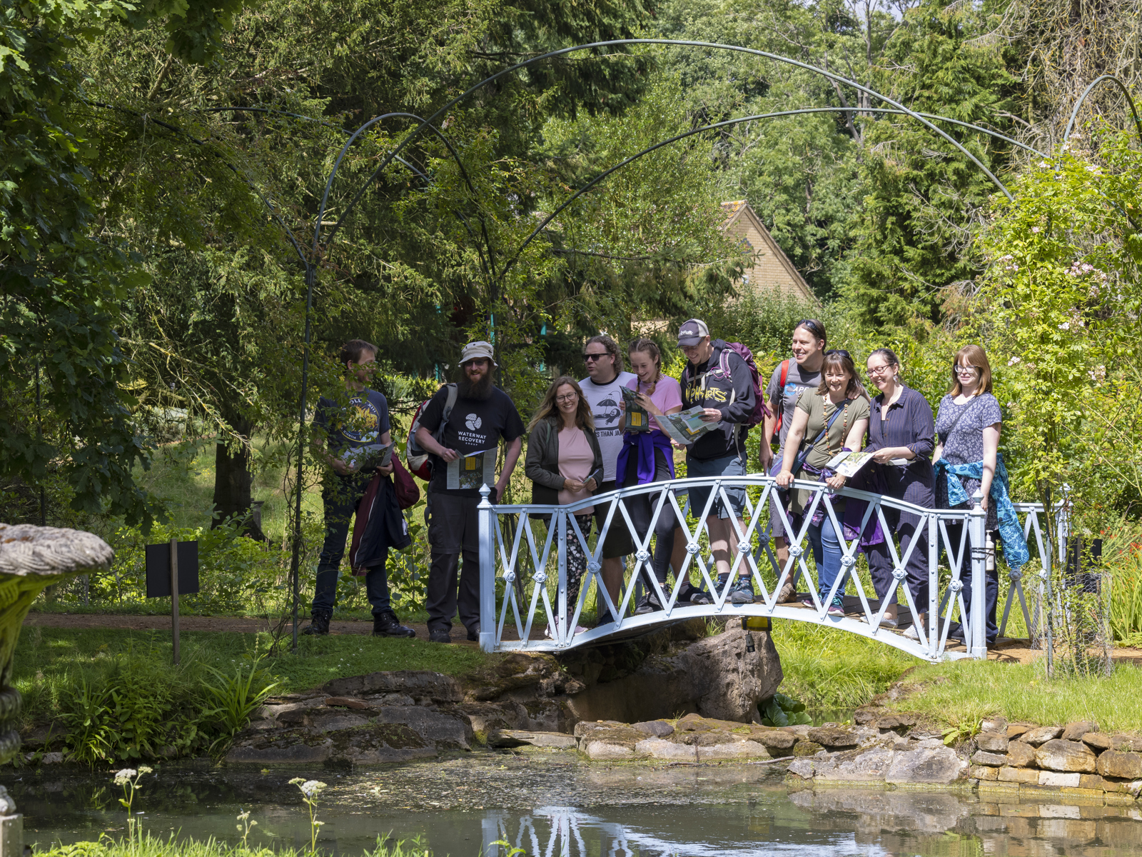 Group On The Bridge In Swiss Garden. © The Shuttleworth Trust. Photo Darren Harbar