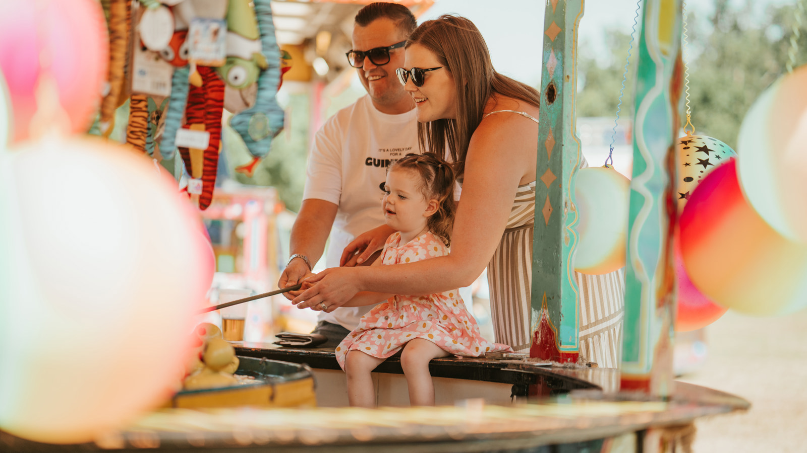 Family Playing Hook A Duck At Summer Fete Open Weekend 2025.© The Shuttleworth Trust. Photo Mach 3 Studio